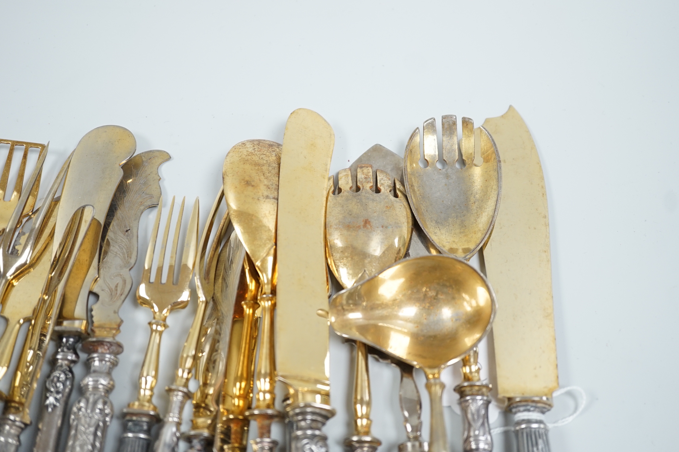 Nineteen assorted items of early 20th century Russian 84 zolotnik cutlery, including servers, butter knives, ladle etc, (loaded handles).